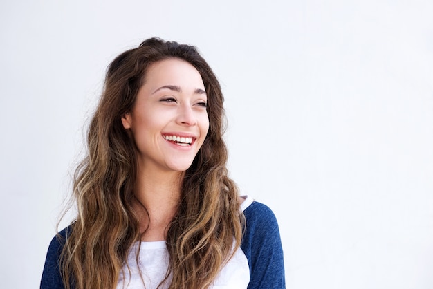 Laughing young woman looking away