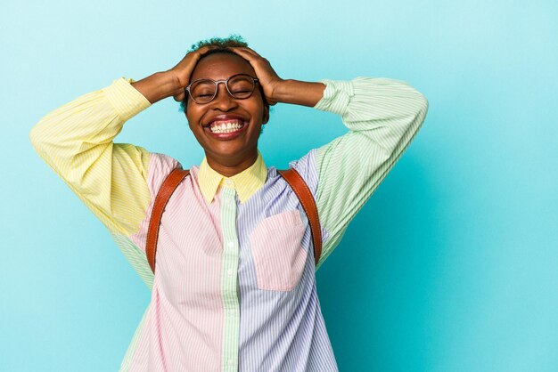 Laughs joyfully keeping hands on head Happiness concept