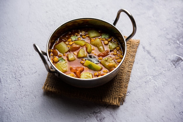 Lauki or Doodhi Chana Dal Subji or Bottlegourd Gram Curry, served in a bowl.selective focus