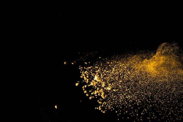 Launched colorful orange dust  particles splashing.