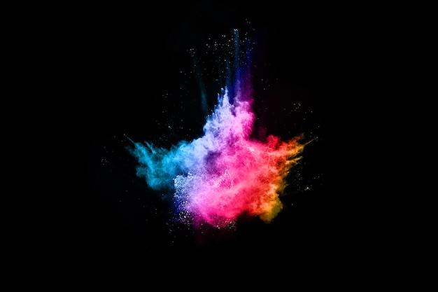 launched colorful powder, isolated on black background.
