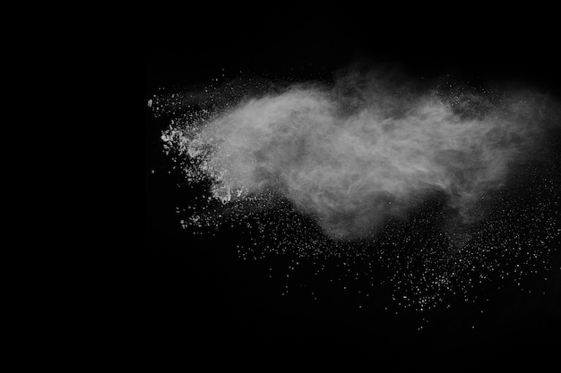 Launched white powder, isolated on black background.