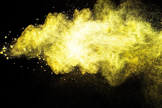 Launched yellow dust  particles splashing.