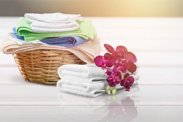 laundry basket with colorful towels on desk