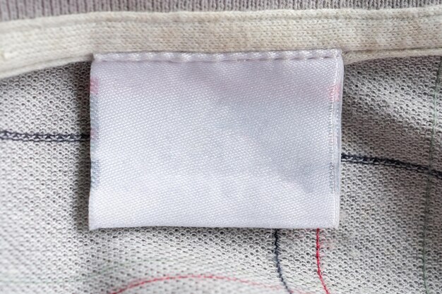 Laundry care clothing label on fabric texture