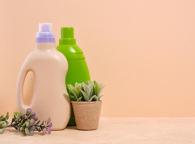 Photo laundry and maid concept dirty clothes detergent and a potted plant copy space for text