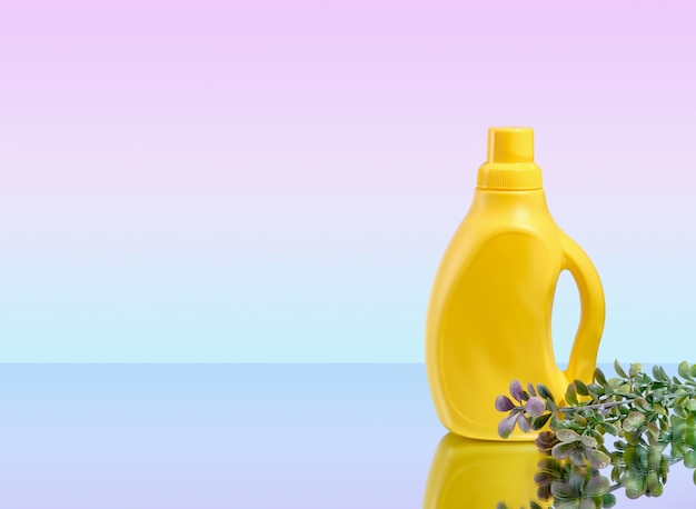 Laundry and maid concept Laundry detergent in a yellow bottle Copy space for text