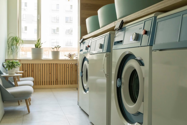 Laundry room interior Washing machines and dryers in a bright home sunny laundry room