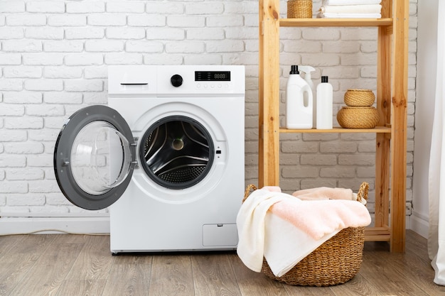 Laundry room with washing machine and basket with laundry