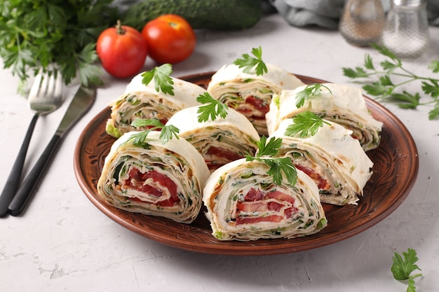 Lavash roll with cucumbers, tomatoes, cheese and parsley