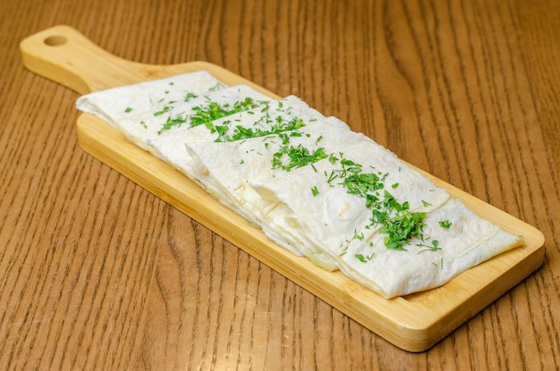 Lavash with cheese and greens