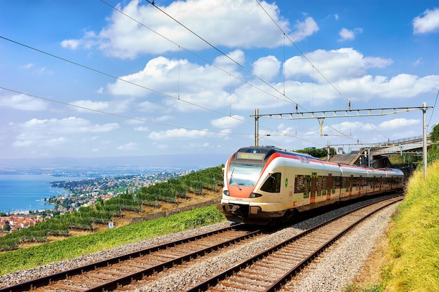 Lavaux, Switzerland - August 30, 2016: Running train in Lavaux Vineyard Terraces hiking trail at Lake Geneva and Swiss Alps, Lavaux-Oron district, Switzerland