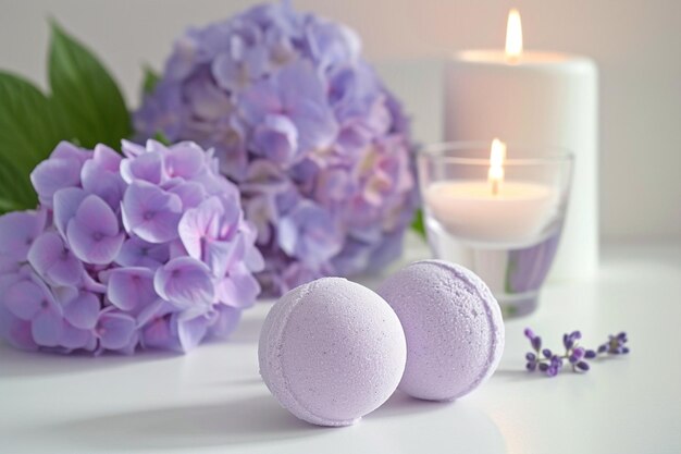 Lavender bath bombs with hortensia on white table lit candle