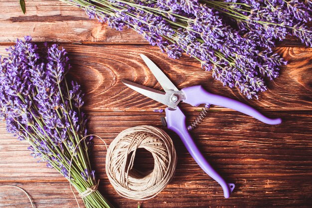 Lavender cutting - cutters and fresh flowers on wooden table