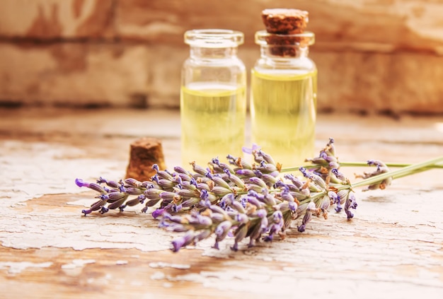 lavender essential oil in a small bottle. selective focus. nature.