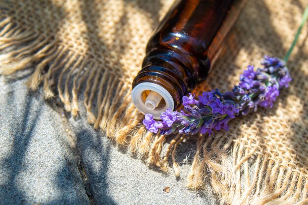 Lavender essential oil in a small bottle. Selective focus.