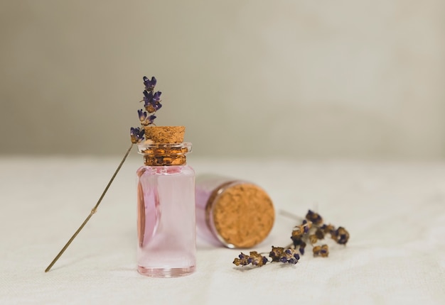 Lavender essential oil with dried lavender bouquet
