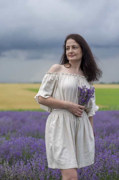 lavender field with sky and clouds and beutyful model