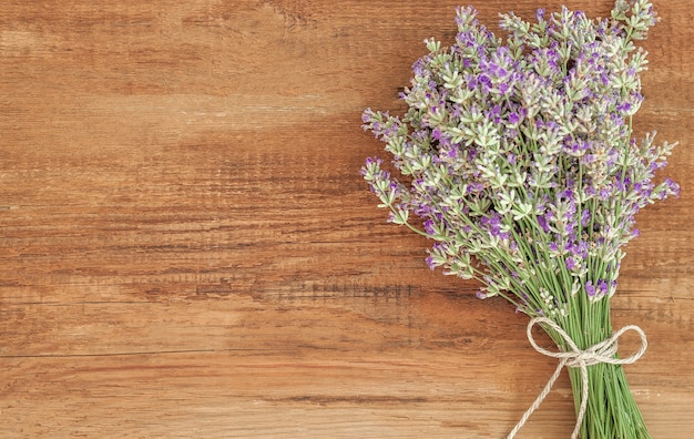 Lavender flower bouquet on wood background