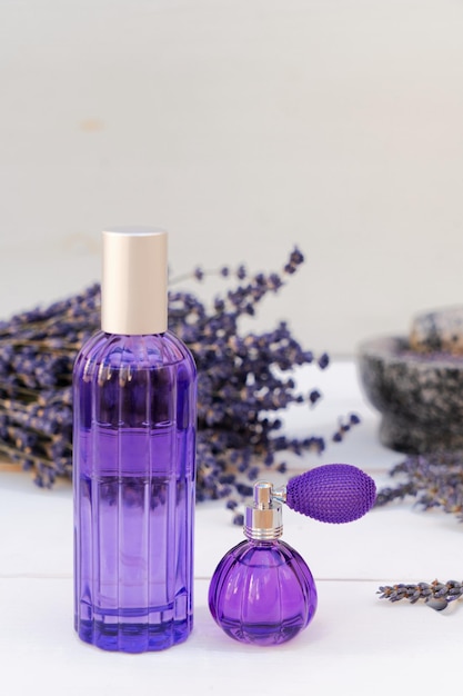 Lavender flowers and lavender oil in the bottles