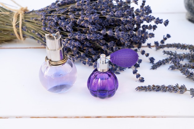 Lavender flowers and lavender oil in glass