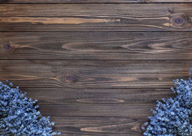 Lavender frame on dark wooden background