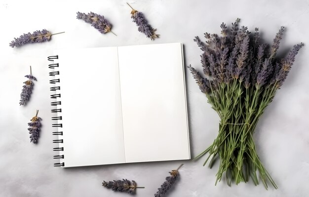 lavender herbs and empty notebook on grey snowy background top view