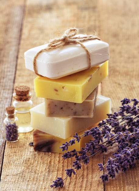 Lavender soap and salt on rustic wooden board Spa concept