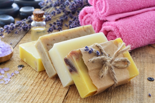 Lavender soap and salt on rustic wooden board