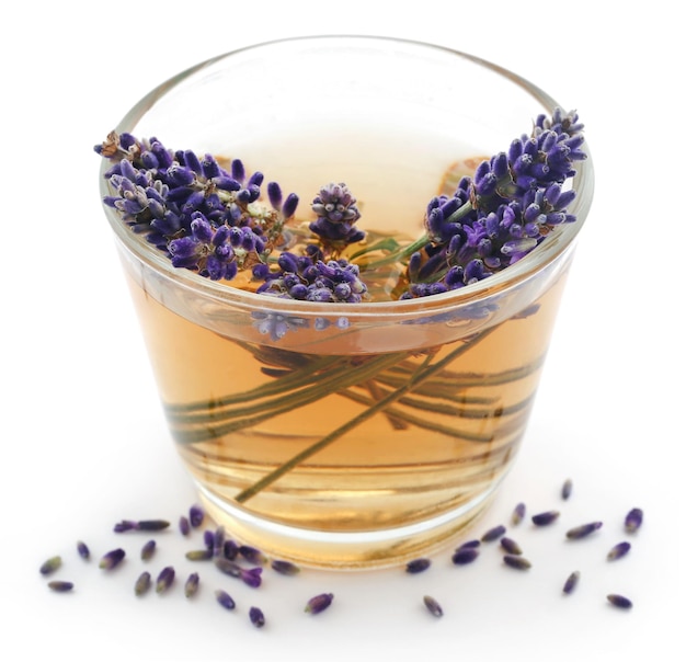 Lavender tea with flower over white background