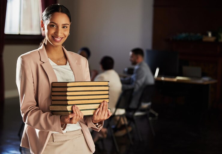 Photo law books happy portrait and woman research legal work office consultation or justice career study financial advisor government consultant and mockup student lawyer smile or attorney education