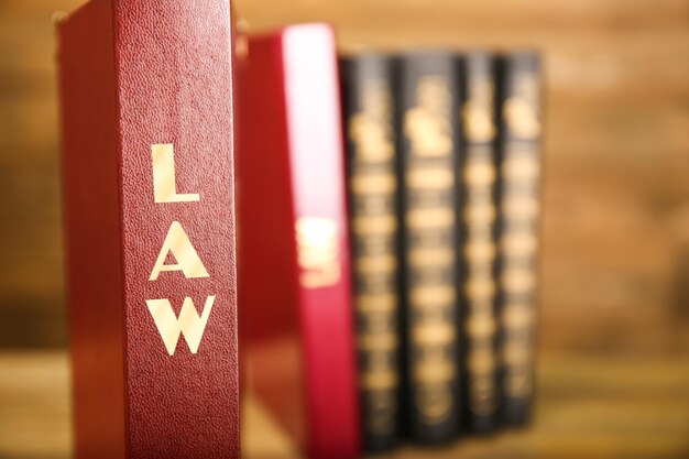Photo law books on wooden background closeup