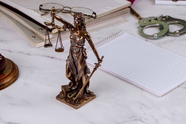 Law figure justice statue in lawyer with file folder law office working document