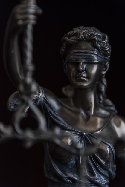 Law and judgment concept Figure of Lady Justice in notary office closeup
