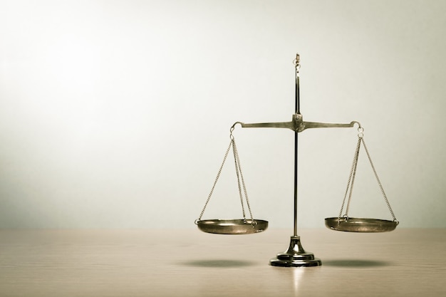 Law scales on table background. Symbol of justice