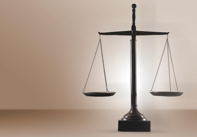 Law scales on table background. Symbol of justice