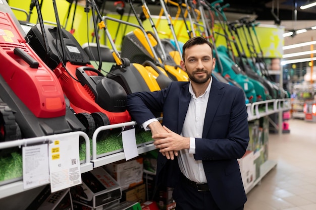 Lawn mower brand representative and scarifier in a gardening equipment store