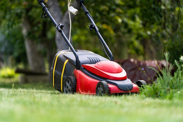 Lawn mower on green grass