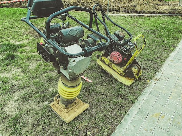 Lawn mowing machine huge lawnmower on oil and gasoline hand tool for creating a smooth landscape