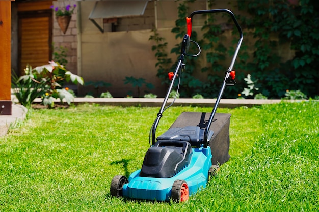 Lawnmower electric machine trimming green grass lawn cutting