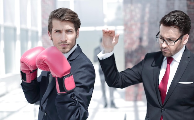 Lawyer in Boxing gloves and his supervisor the concept of business competition