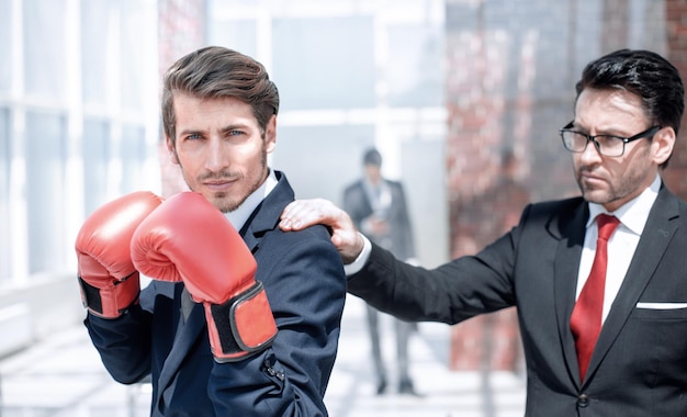 Photo lawyer in boxing gloves and his supervisor the concept of business competition