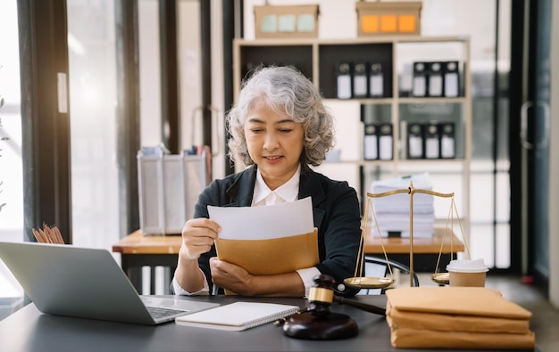 Lawyer business man working with paperwork on his desk in office workplace for consultant lawyer in office