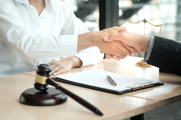 Lawyer handshake with client Business partnership meeting successful concept