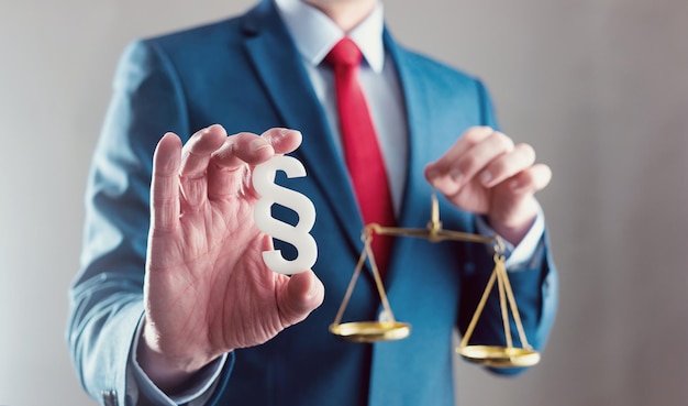 Lawyer holding libra with paragraph symbol law concept image