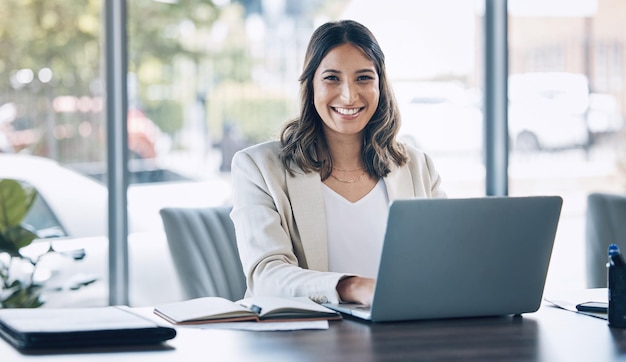 Lawyer portrait and laptop in office planning legal consulting or policy review feedback in corporate law firm Smile happy and attorney woman on technology in case research or schedule management