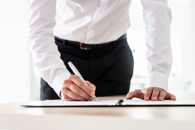 Lawyer signing an important document