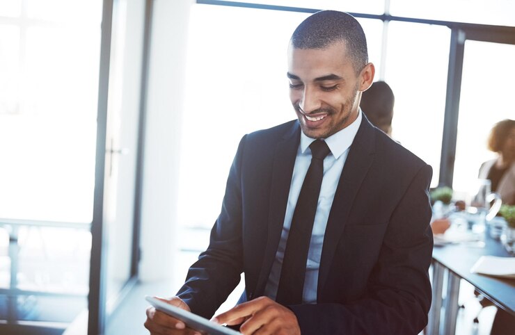 Photo lawyer tablet and happy man in office for business email online research app or working smile technology or corporate attorney reading information internet website or typing to scroll in company