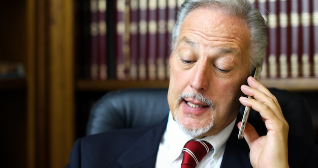 Lawyer talking on the phone in his studio