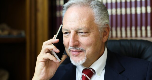 Lawyer talking on the phone in his studio